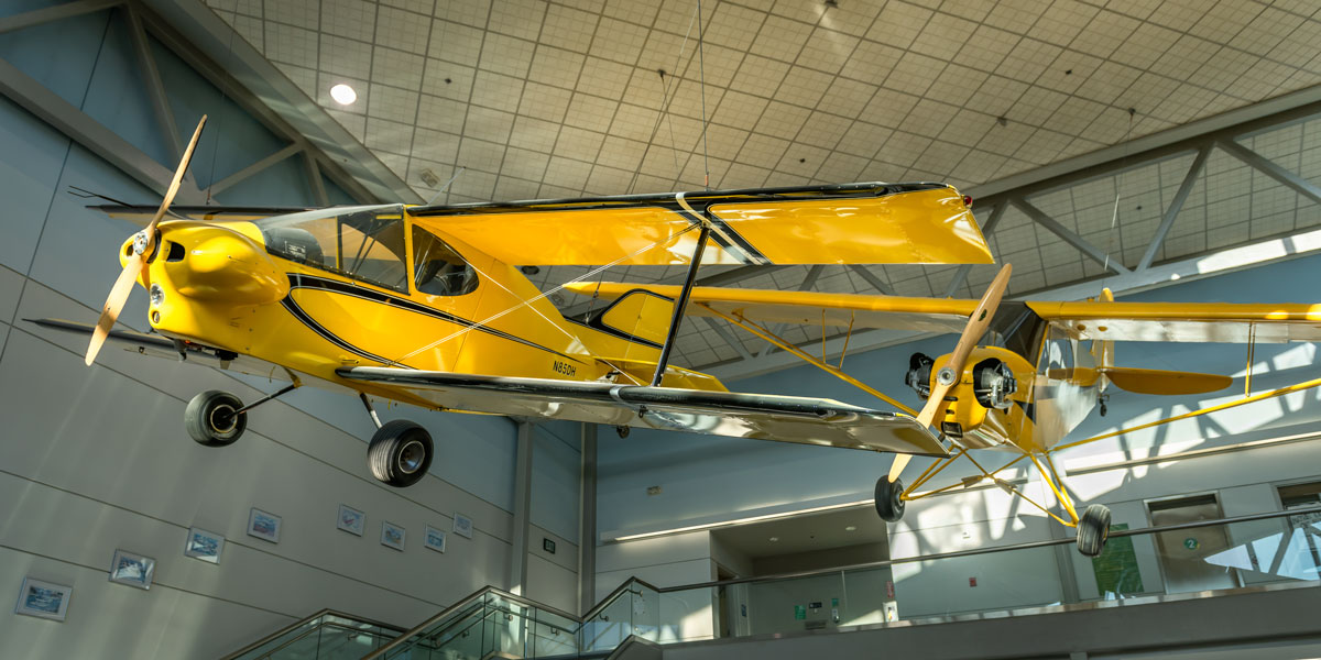 Yellow aircraft inside the UAA Aviation Technology Center