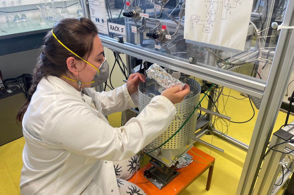A student working with laboratory equipment
